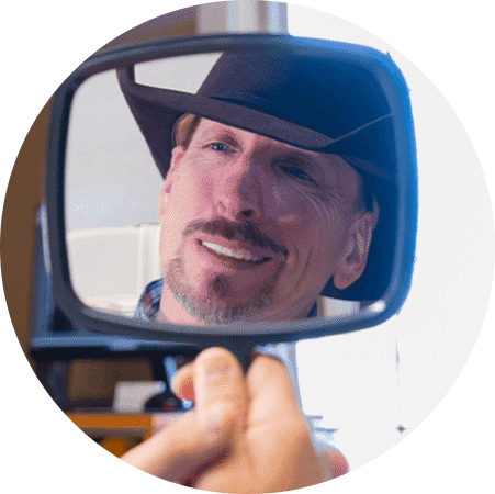 Confident patient smiling after implant treatment